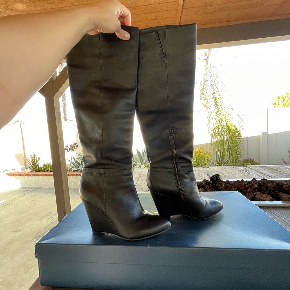 Black wedge knee high leather boots